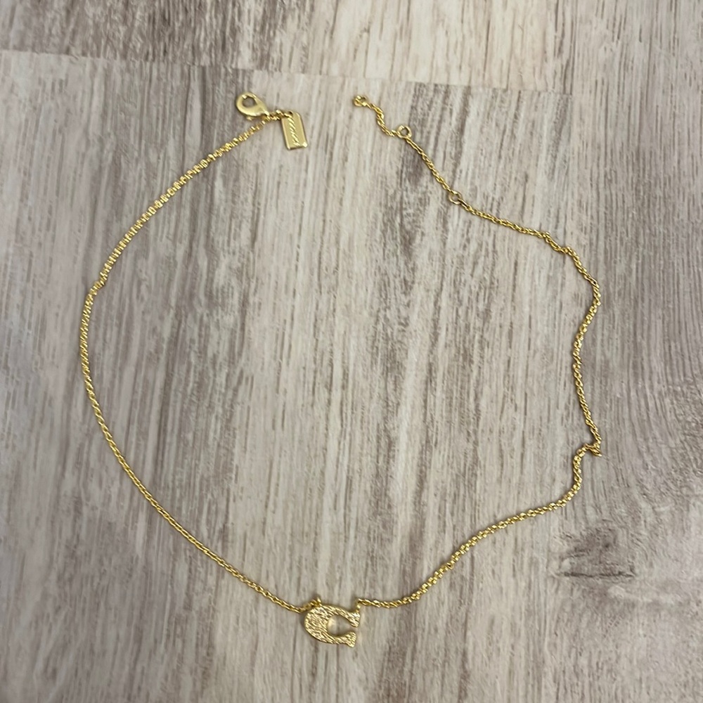 Coach genuine gold plated necklace unused
